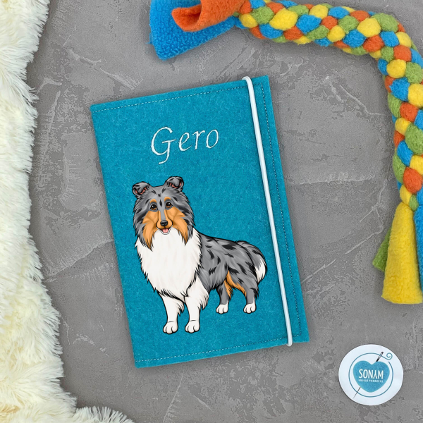 Designbeispiel der Impfpasshülle türkis für die Hunderasse Collie Langhaar blue merle